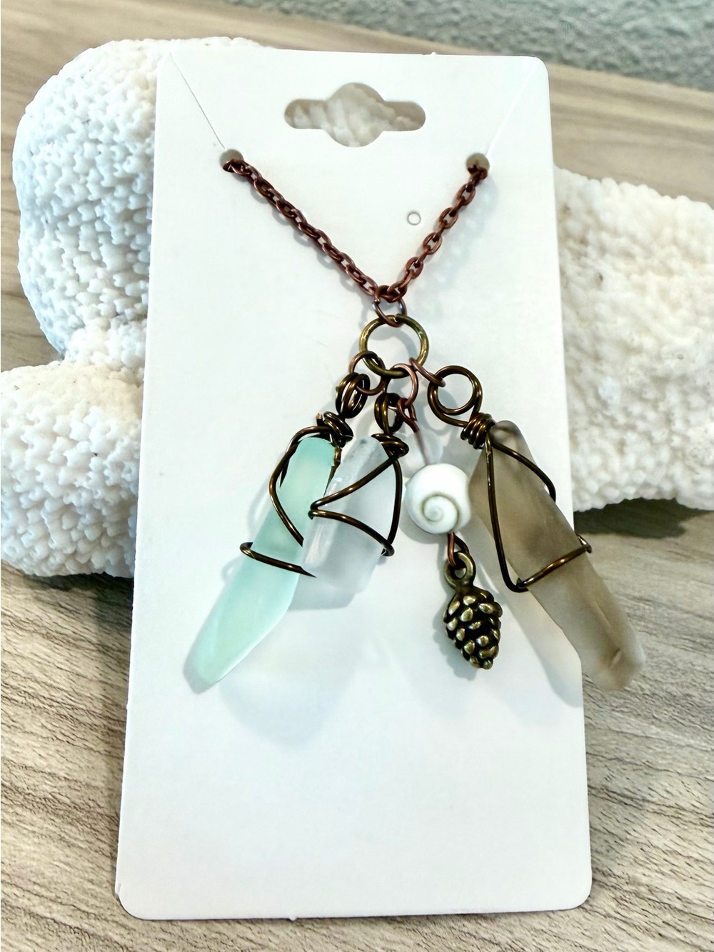 12. Multi colored sea glass necklace with shiva shell and pine cone charm